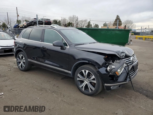 2017 Volkswagen Touareg Wolfsburg Edition with VIN WVGRF7BP9HD006520, listed as a Copart auction lot 84168634 with 76,596 mi miles and Salvage title. Bid and sale history available at DreamBid. Image 4.