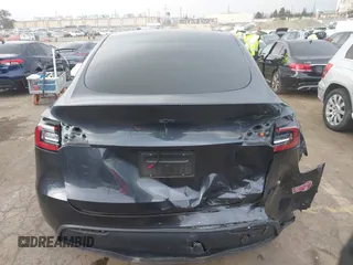 2024 Tesla Model Y with VIN 7SAYGDED8RF116209, listed as a IAAI auction lot 41761804 with 12,048 mi miles and . Bid and sale history available at DreamBid. Image 16.