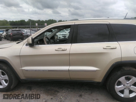 2012 Jeep Grand Cherokee Laredo with VIN 1C4RJEAGXCC157616, listed as a IAAI auction lot 42156539 with 301,661 mi miles. Bid and sale history available at carsss.com. Image 14.