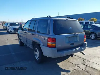 1996 Jeep Grand Cherokee Laredo with VIN 1J4FX58S8TC169575, listed as a IAAI auction lot 40971134 with 152,116 mi miles. Bid and sale history available at carsss.com. Image 3.