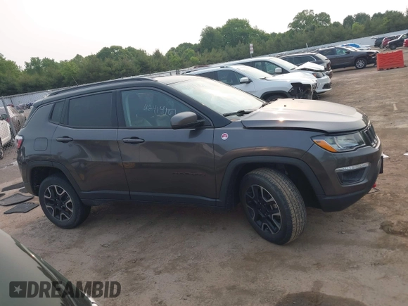 2019 Jeep Compass Trailhawk z VIN 3C4NJDDB9KT686048, wystawiony jako IAAI lot #42414161 z przebiegiem 92 683 mil mil oraz . Historia ofert i sprzedaży dostępna na DreamBid. Obrazek 12.