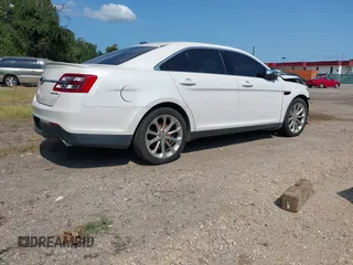 2014 Ford Taurus Limited with VIN 1FAHP2F8XEG181491, listed as a IAAI auction lot 40277144 with 107,374 mi miles. Bid and sale history available at carsss.com. Image 4.