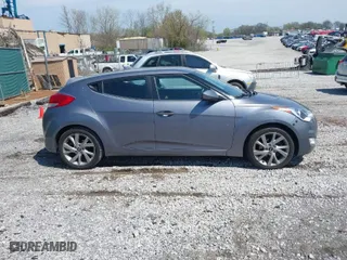 2017 Hyundai Veloster with VIN KMHTC6AD8HU305853, listed as a IAAI auction lot 41915404 with 115,663 mi miles. Bid and sale history available at carsss.com. Image 13.