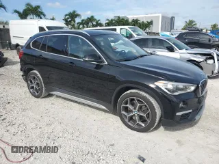 2019 BMW X1 xDrive28i with VIN WBXHT3C59K5L36435, listed as a Copart auction lot 60189985 with 105,110 mi miles and Salvage title. Bid and sale history available at DreamBid. Image 4.