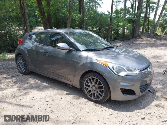 2012 Hyundai Veloster w/Black Int with VIN KMHTC6AD3CU078547, listed as a IAAI auction lot 42633915 with 143,633 mi miles and . Bid and sale history available at DreamBid. Image 1.