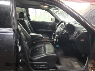 1997 Nissan Maxima with VIN HBY33200347, listed as a Copart auction lot 47182085 with 173,662 mi miles and Salvage title. Bid and sale history available at DreamBid. Image 7.