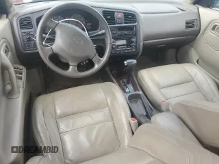 2001 Infiniti G20 Luxury z VIN JNKCP11A61T404490, wystawiony jako Copart lot #62502544 z przebiegiem 132 014 mil mil oraz Tytuł czysty. Historia ofert i sprzedaży dostępna na DreamBid. Obrazek 8.