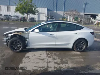 2021 Tesla Model 3 Long Range with VIN 5YJ3E1EB9MF055990, listed as a IAAI auction lot 41584065 with 49,147 mi miles and . Bid and sale history available at carsss.com. Image 15.