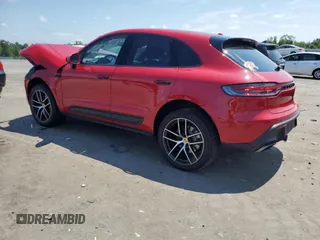 2023 Porsche Macan with VIN WP1AA2A54PLB07597, listed as a Copart auction lot 64077345 with 50,704 mi miles and Salvage title. Bid and sale history available at DreamBid. Image 2.