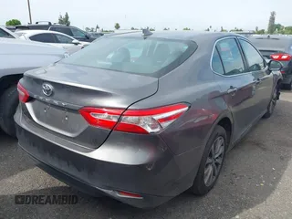 2019 Toyota Camry LE with VIN 4T1B11HK4KU254853, listed as a IAAI auction lot 42013255 with 153,664 mi miles and . Bid and sale history available at DreamBid. Image 4.