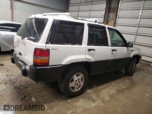 1995 Jeep Grand Cherokee Laredo with VIN 1J4GZ58S6SC630947, listed as a Copart auction lot 82143564 with 267,946 mi miles and Salvage Title. Bid and sale history available at carsss.com. Image 3.