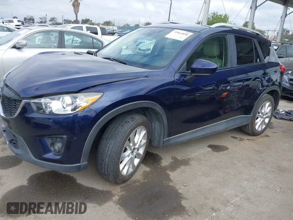 2014 Mazda CX-5 Grand Touring with VIN JM3KE2DY1E0307911, listed as a IAAI auction lot 42064898 with 133,934 mi miles. Bid and sale history available at carsss.com. Image 19.