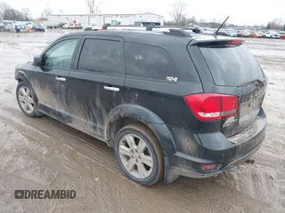 2013 Dodge Journey R/T with VIN 3C4PDDFG7DT724534, listed as a IAAI auction lot 41161346 with 175,606 mi miles and . Bid and sale history available at DreamBid. Image 3.