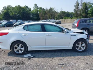 2015 Kia Optima LX z VIN KNAGM4A76F5569420, wystawiony jako IAAI lot #42423133 z przebiegiem 93 094 mil mil oraz . Historia ofert i sprzedaży dostępna na DreamBid. Obrazek 14.