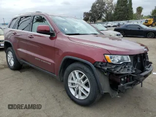 2018 Jeep Grand Cherokee Laredo E with VIN 1C4RJEAG5JC253697, listed as a Copart auction lot 53402515 with 55,649 mi miles and Salvage title. Bid and sale history available at DreamBid. Image 4.