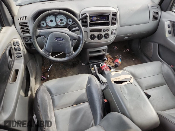 2003 Ford Escape XLT Popular with VIN 1FMCU03123KA03878, listed as a Copart auction lot 60133485 with 298,100 mi miles and Salvage title. Bid and sale history available at DreamBid. Image 8.