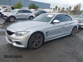 2015 BMW 4 Series 428i with VIN WBA3V7C50FP772915, listed as a IAAI auction lot 41526014 with 116,800 mi miles. Bid and sale history available at carsss.com. Image 2.