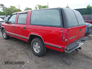 1992 GMC Suburban z VIN 1GKEC16K9NJ722021, wystawiony jako IAAI lot #42255371 z przebiegiem 180 966 mil mil oraz . Historia ofert i sprzedaży dostępna na DreamBid. Obrazek 3.