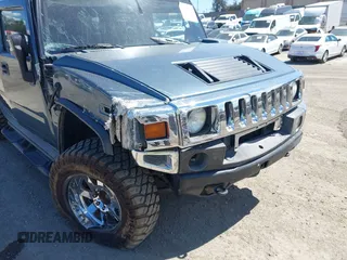 2005 Hummer H2 SUV with VIN 5GRGN23U35H105620, listed as a IAAI auction lot 41912574 with 232,938 mi miles. Bid and sale history available at carsss.com. Image 6.