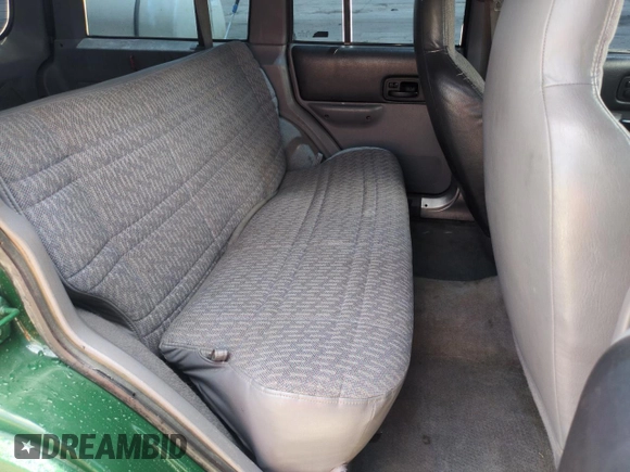 1998 Jeep Cherokee Sport with VIN 1J4FJ68SXWL210381, listed as a Copart auction lot 58398995 with 211,870 mi miles and Salvage title. Bid and sale history available at DreamBid. Image 11.