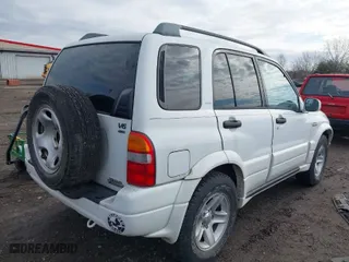 2001 Suzuki Grand Vitara JLX with VIN JS3TD62V114157738, listed as a IAAI auction lot 41721813 with 134,661 mi miles. Bid and sale history available at carsss.com. Image 4.
