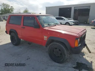 1995 Jeep Cherokee SE with VIN 1J4FT27P9SL561969, listed as a Copart auction lot 53295865 with 151,377 mi miles and Salvage title. Bid and sale history available at DreamBid. Image 4.