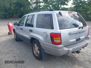 2004 Jeep Grand Cherokee Laredo z VIN 1J4GW48S54C106405, wystawiony jako IAAI lot #42315689 z przebiegiem 104 416 mil mil oraz . Historia ofert i sprzedaży dostępna na DreamBid. Obrazek 3.