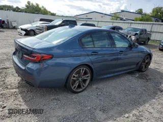 2023 BMW 5 Series M550i xDrive z VIN WBA13BK02PCN82953, wystawiony jako Copart lot #68124264 z przebiegiem 10 010 mil mil oraz Szkoda całkowita • Salvage title. Historia ofert i sprzedaży dostępna na DreamBid. Obrazek 3.