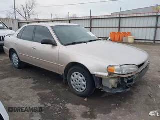 1996 Toyota Camry DX with VIN 4T1BG12K8TU738565, listed as a IAAI auction lot 41702096 with 100,587 mi miles. Bid and sale history available at carsss.com. Image 1.