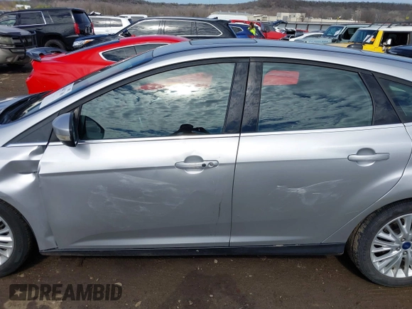 2017 Ford Focus Titanium with VIN 1FADP3N26HL309903, listed as a IAAI auction lot 41642306 with 107,762 mi miles and . Bid and sale history available at carsss.com. Image 14.