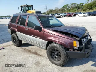 1997 Jeep Grand Cherokee Laredo with VIN 1J4GZ58S5VC688455, listed as a Copart auction lot 74294204 with 135,143 mi miles and Salvage Title. Bid and sale history available at carsss.com. Image 4.