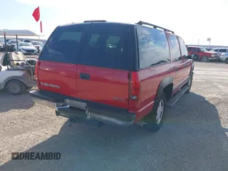 1999 GMC Suburban with VIN 1GKFK16RXXJ809823, listed as a IAAI auction lot 41687406 with 360,799 mi miles. Bid and sale history available at carsss.com. Image 4.