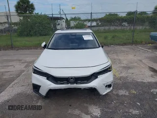 2023 Honda Civic EX-L with VIN 19XFL1H70PE014510, listed as a IAAI auction lot 42395890 with 14,163 mi miles and . Bid and sale history available at DreamBid. Image 6.
