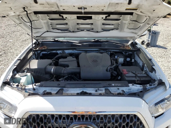 2019 Toyota Tacoma SR z VIN 3TMCZ5AN1KM263494, wystawiony jako Copart lot #54710695 z przebiegiem 57 216 mil mil oraz Szkoda całkowita • Salvage title. Historia ofert i sprzedaży dostępna na DreamBid. Obrazek 11.