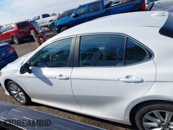 2020 Toyota Camry LE with VIN 4T1C11AKXLU986310, listed as a IAAI auction lot 40977100 with 108,208 mi miles and . Bid and sale history available at DreamBid. Image 14.
