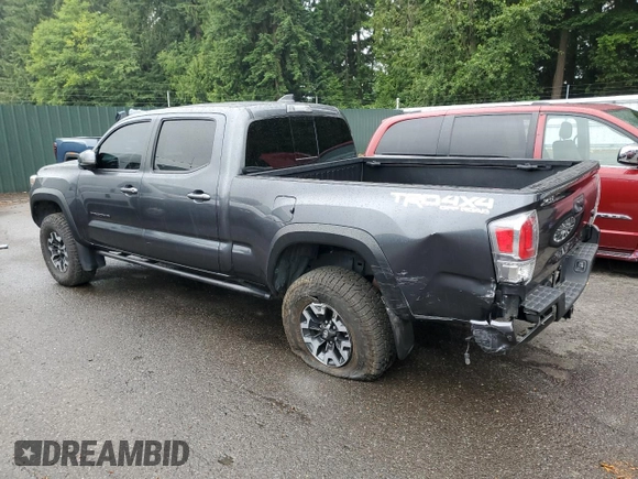 2020 Toyota Tacoma SR5 with VIN 3TMDZ5BN2LM097782, listed as a Copart auction lot 61573465 with 57,321 mi miles and Salvage title. Bid and sale history available at DreamBid. Image 2.