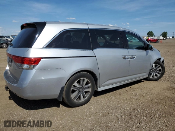 2014 Honda Odyssey Touring with VIN 5FNRL5H91EB502555, listed as a Copart auction lot 61872285 with 203,448 mi miles and Salvage title. Bid and sale history available at DreamBid. Image 3.