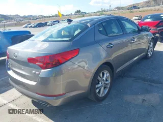 2013 Kia Optima EX z VIN 5XXGN4A70DG252497, wystawiony jako IAAI lot #42145025 z przebiegiem 90 867 mil mil oraz . Historia ofert i sprzedaży dostępna na DreamBid. Obrazek 4.