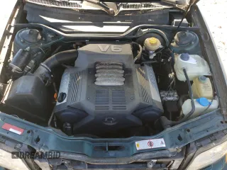 1995 Audi A6 z VIN WAUHA84A1SN052824, wystawiony jako Copart lot #78849124 z przebiegiem 152 894 mil mil oraz Szkody całkowita. Historia ofert i sprzedaży dostępna na DreamBid. Obrazek 11.