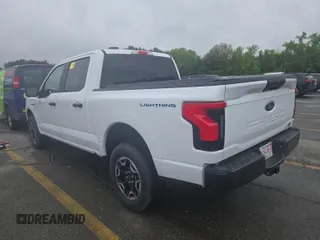 2023 Ford F-150 Lightning Pro z VIN 1FTVW1EL0PWG02840, wystawiony jako IAAI lot #42379448 z przebiegiem 52 710 mil mil oraz . Historia ofert i sprzedaży dostępna na DreamBid. Obrazek 10.