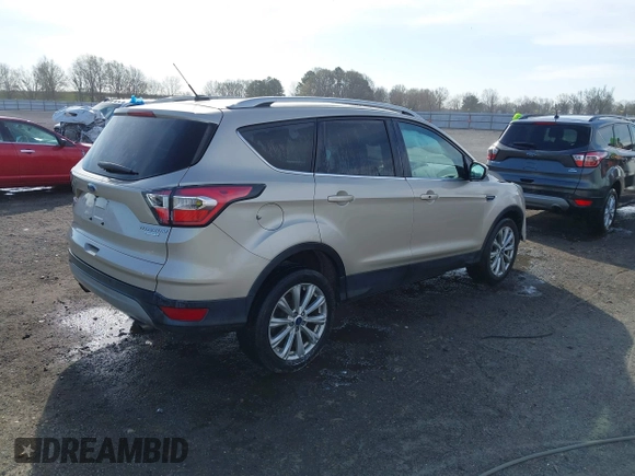 2017 Ford Escape Titanium with VIN 1FMCU0JD3HUB19602, listed as a IAAI auction lot 41816296 with 70,311 mi miles. Bid and sale history available at carsss.com. Image 4.