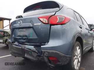 2015 Mazda CX-5 Grand Touring with VIN JM3KE4DY0F0493969, listed as a IAAI auction lot 41581885 with 71,014 mi miles. Bid and sale history available at carsss.com. Image 6.
