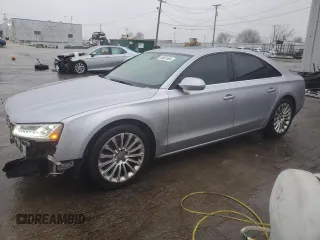 2015 Audi A8 z VIN WAUJGAFD0FN010021, wystawiony jako Copart lot #86861684 z przebiegiem 112 697 mil mil oraz Szkoda całkowita • Salvage title. Historia ofert i sprzedaży dostępna na DreamBid. Obrazek 1.