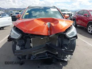 2014 Hyundai Santa Fe z VIN 5XYZUDLB4EG138898, wystawiony jako IAAI lot #42196491 z przebiegiem Nie podano mil oraz . Historia ofert i sprzedaży dostępna na DreamBid. Obrazek 12.