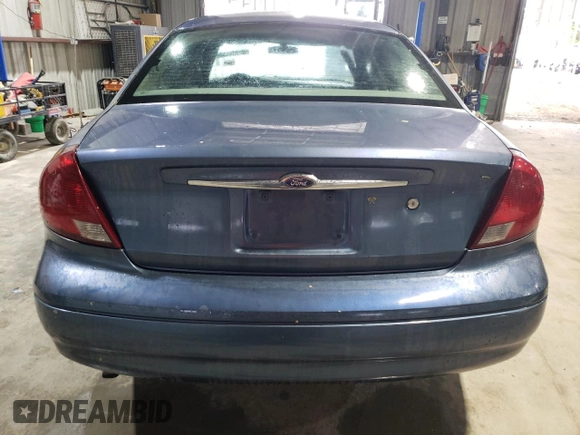 2004 Ford Taurus SE z VIN 1FAFP532X4A187754, wystawiony jako Copart lot #51262185 z przebiegiem 121 663 mil mil oraz Szkoda całkowita • Salvage title. Historia ofert i sprzedaży dostępna na DreamBid. Obrazek 6.