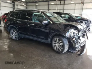 2017 Honda Pilot Touring with VIN 5FNYF6H97HB036935, listed as a Copart auction lot 71757334 with 68,641 mi miles and Salvage Title. Bid and sale history available at DreamBid. Image 4.