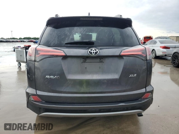 2018 Toyota RAV4 XLE with VIN 2T3WFREV6JW411935, listed as a Copart auction lot 54218405 with 123,831 mi miles and Salvage title. Bid and sale history available at DreamBid. Image 6.
