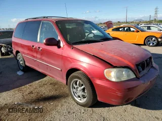 2005 Kia Sedona LX with VIN KNDUP132156669009, listed as a Copart auction lot 76936094 with 124,989 mi miles and Salvage Title. Bid and sale history available at carsss.com. Image 4.