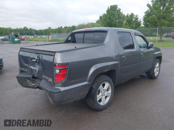 2014 Honda Ridgeline RTL with VIN 5FPYK1F5XEB011772, listed as a IAAI auction lot 42440390 with 145,219 mi miles and . Bid and sale history available at DreamBid. Image 4.