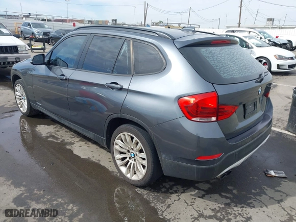 2013 BMW X1 28i with VIN WBAVM1C55DVW41609, listed as a IAAI auction lot 41604038 with 126,036 mi miles. Bid and sale history available at carsss.com. Image 3.